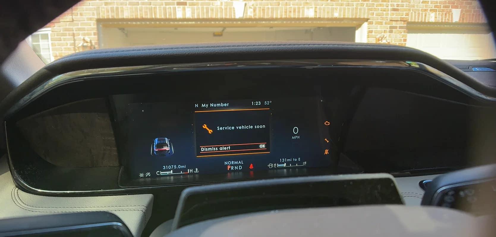 Vehicle dashboard displaying a warning that needs a clear next step