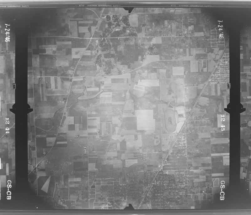 Complete July 1, 1946 USGS aerial exposure centered on Arlington Heights, showing the rail corridor, compact village grid, farms, roads, and adjoining open land