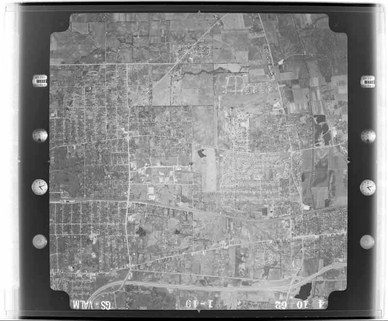 Complete USGS aerial photograph of Lisle neighborhoods, roads, railroad corridor, tollway, and remaining open land