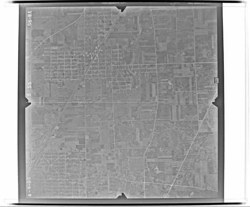 Complete April 8, 1952 federal aerial exposure of Mount Prospect’s rail and highway center, neighborhoods, expanding street grid, and adjoining farmland