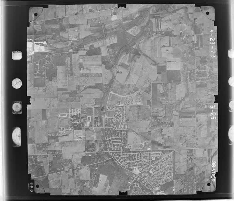 Complete USGS aerial photograph of Naperville subdivisions, roads, the DuPage River corridor, and remaining farmland